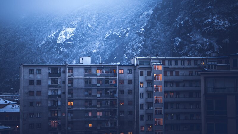 apartment buildings in snowy mountains