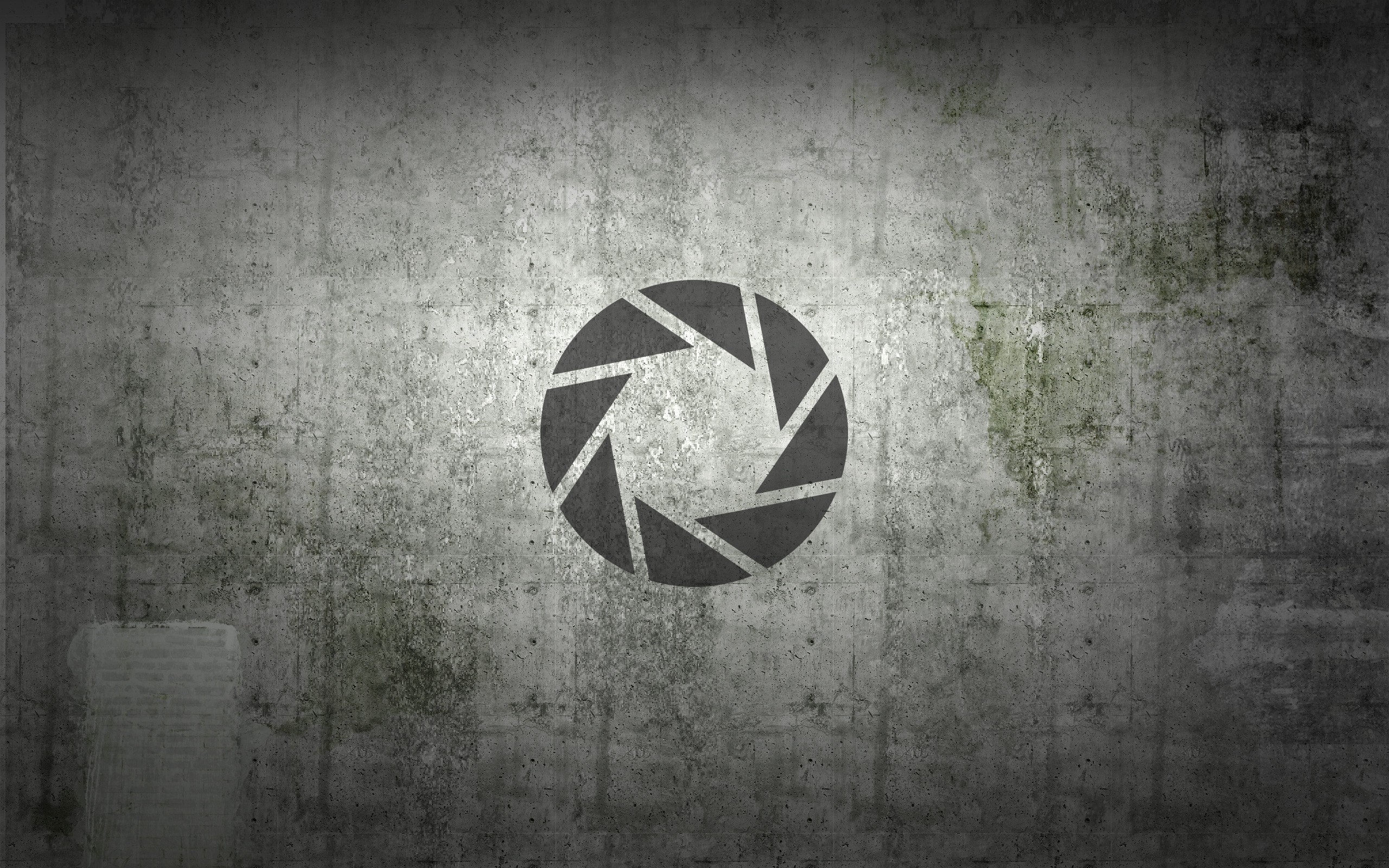 Aperture Science logo on concrete