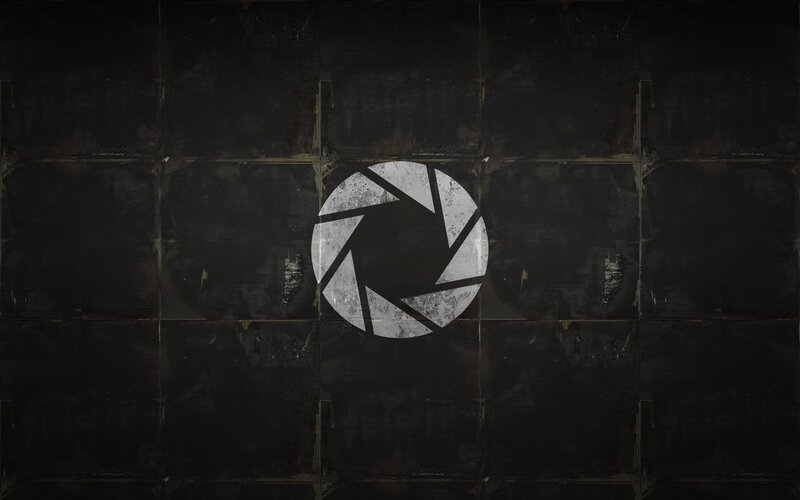 Aperture Science logo on dark wall