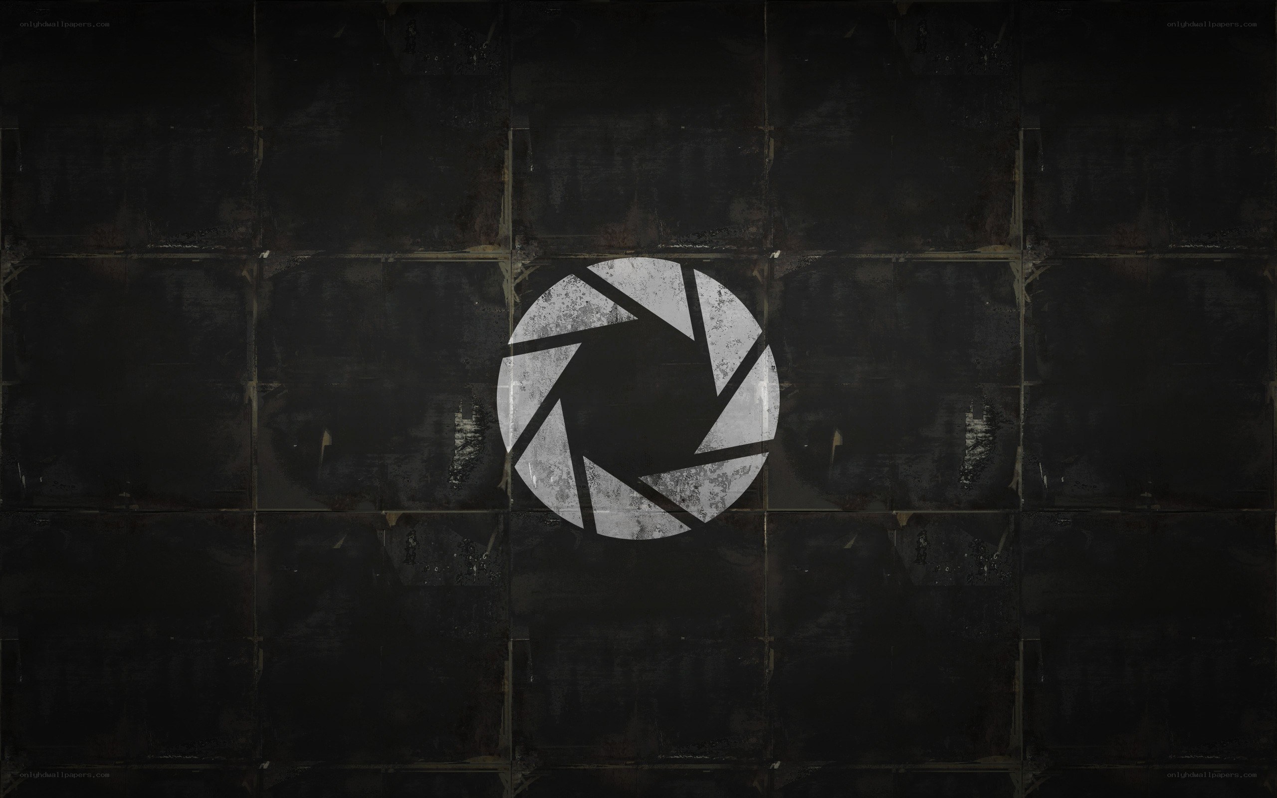 Aperture Science logo on dark wall