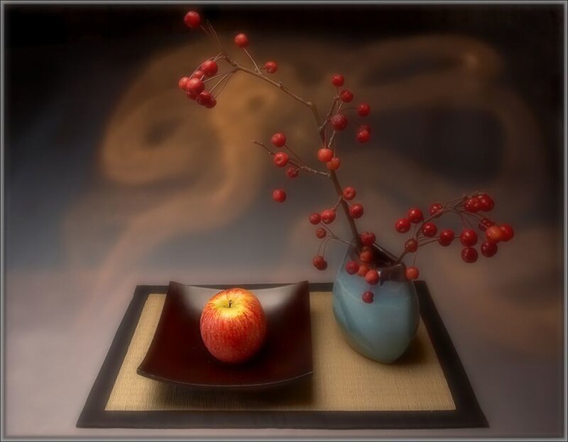 apple and berries in vase