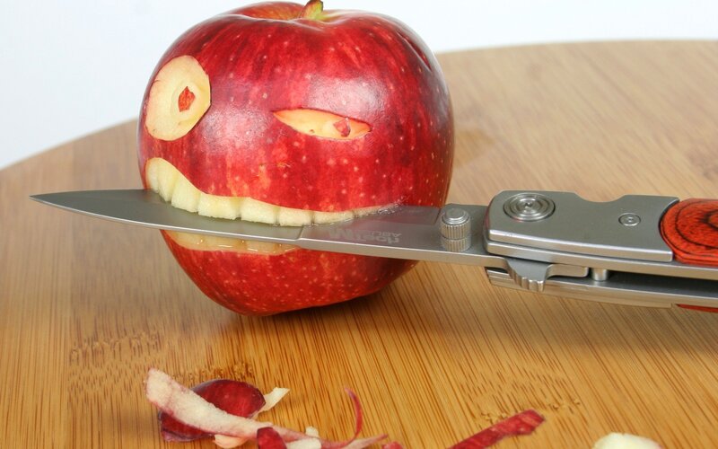 apple carved into a face
