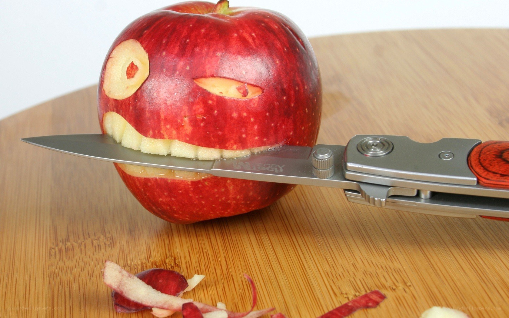 apple carved into a face