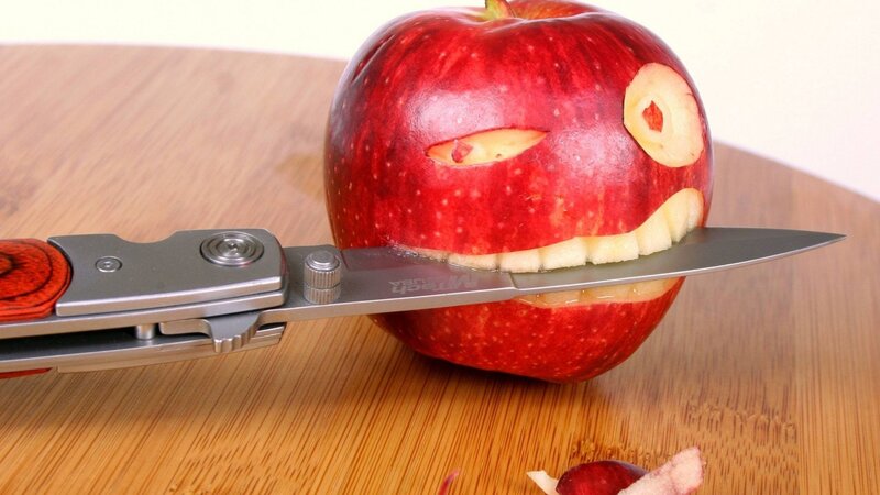 Apple Carved into Face — Red, Playful, Photograph, Knife