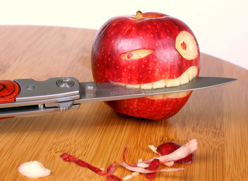 Apple Carved into Face — Red, Playful, Photograph