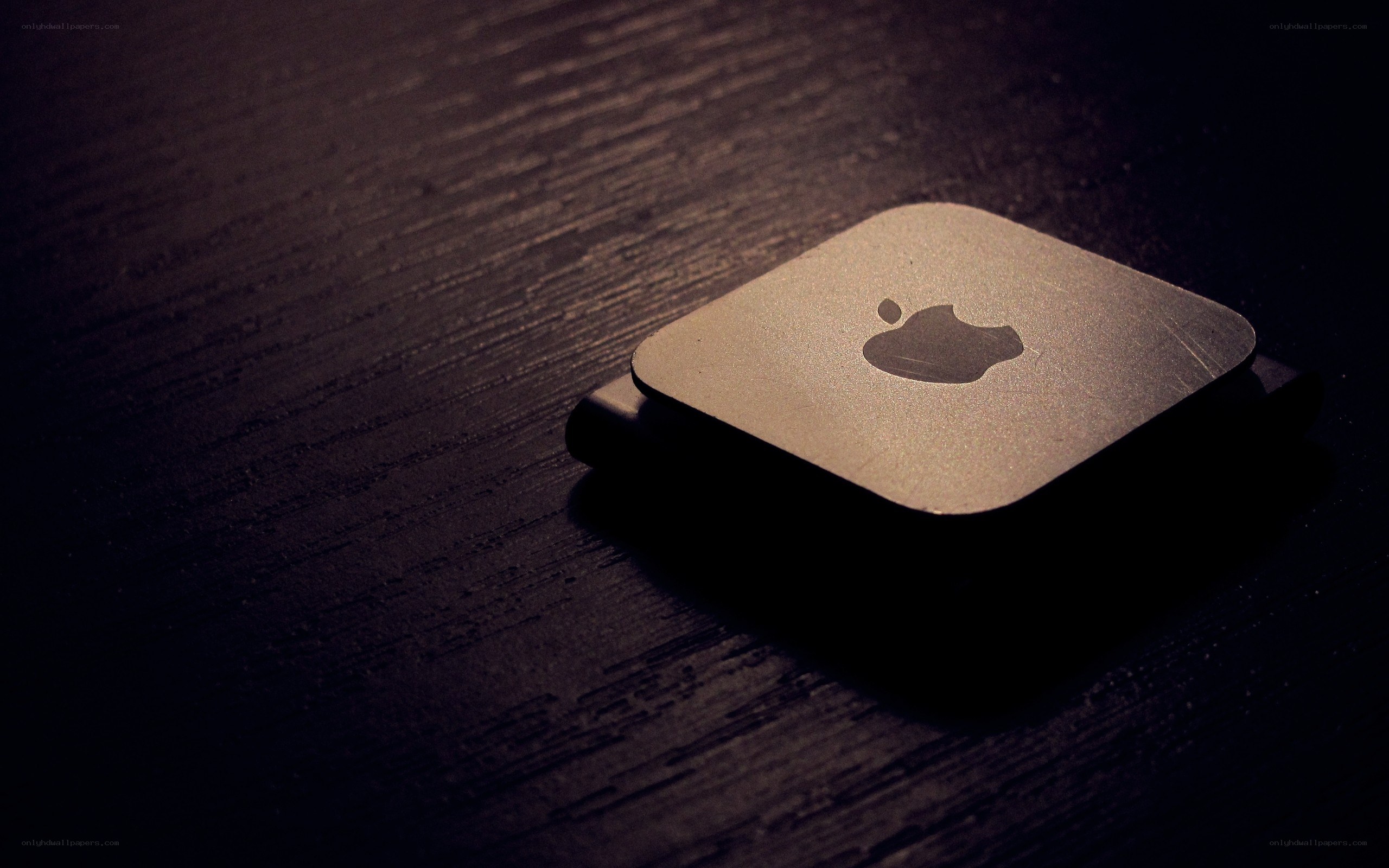 Apple device on wooden surface
