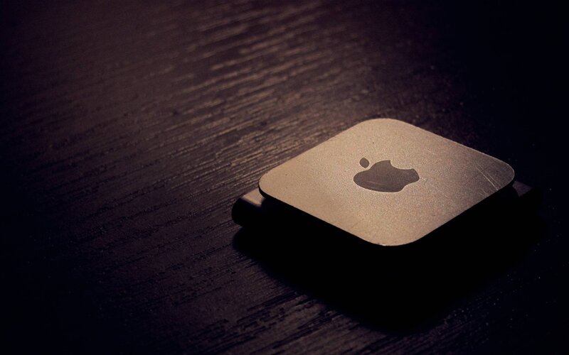 Apple device on wooden surface