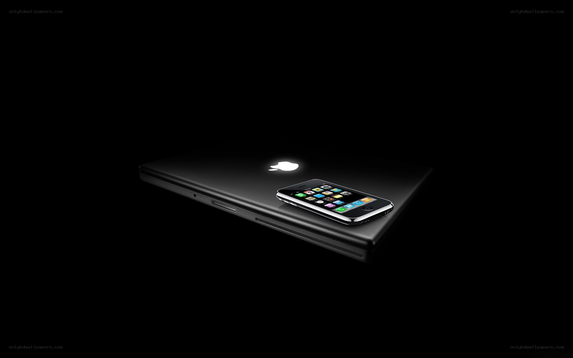 Apple devices on black background