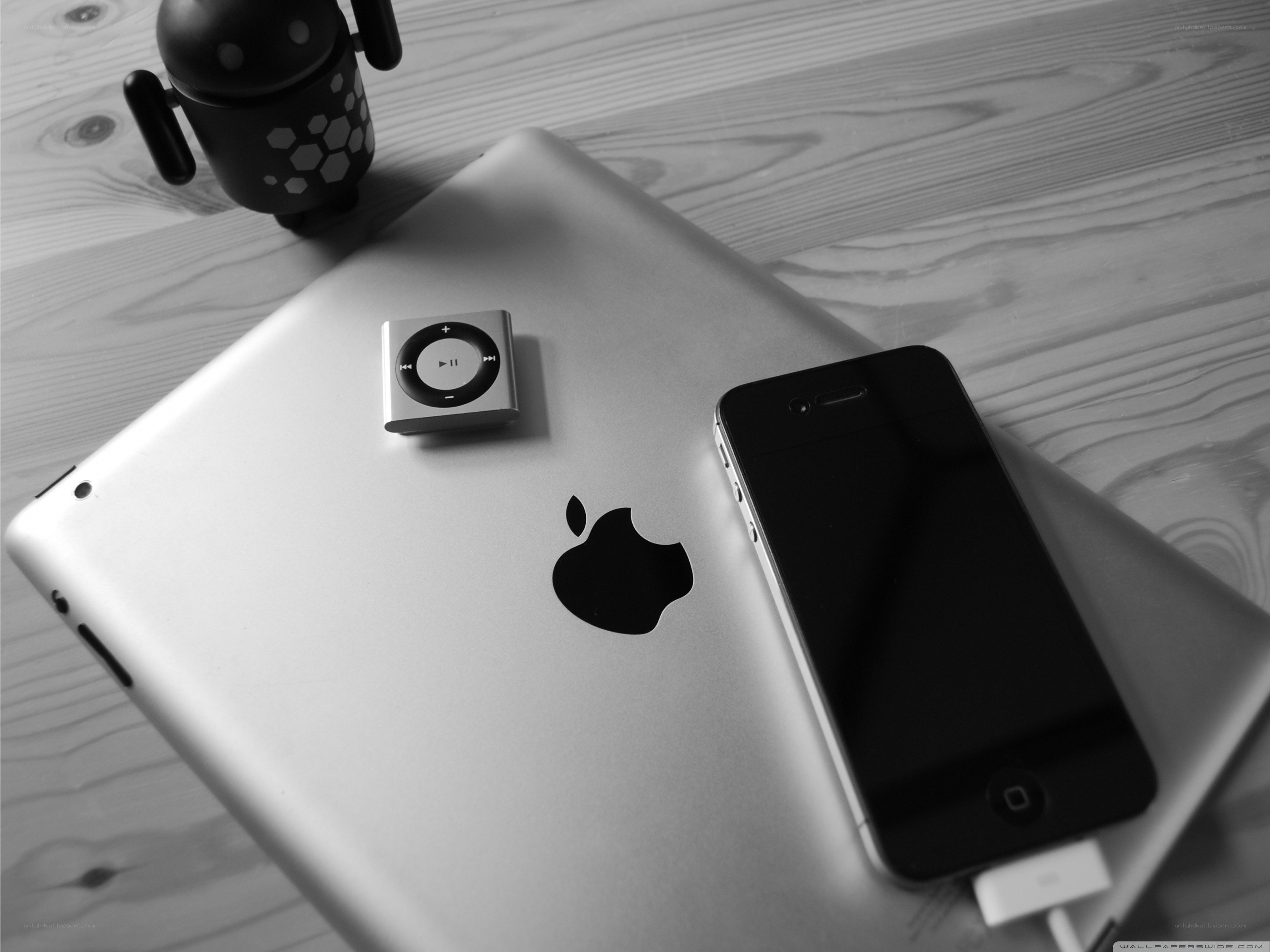 Apple devices on wooden surface