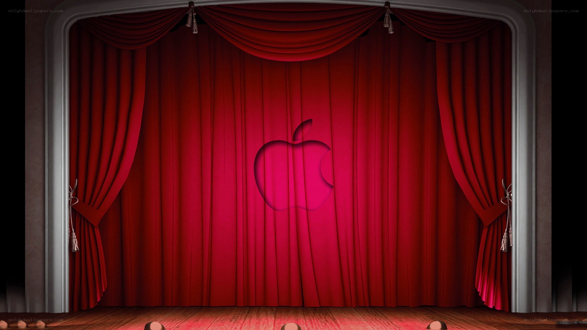 Apple event stage with red curtain