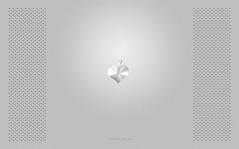 Apple heart logo on silver laptop
