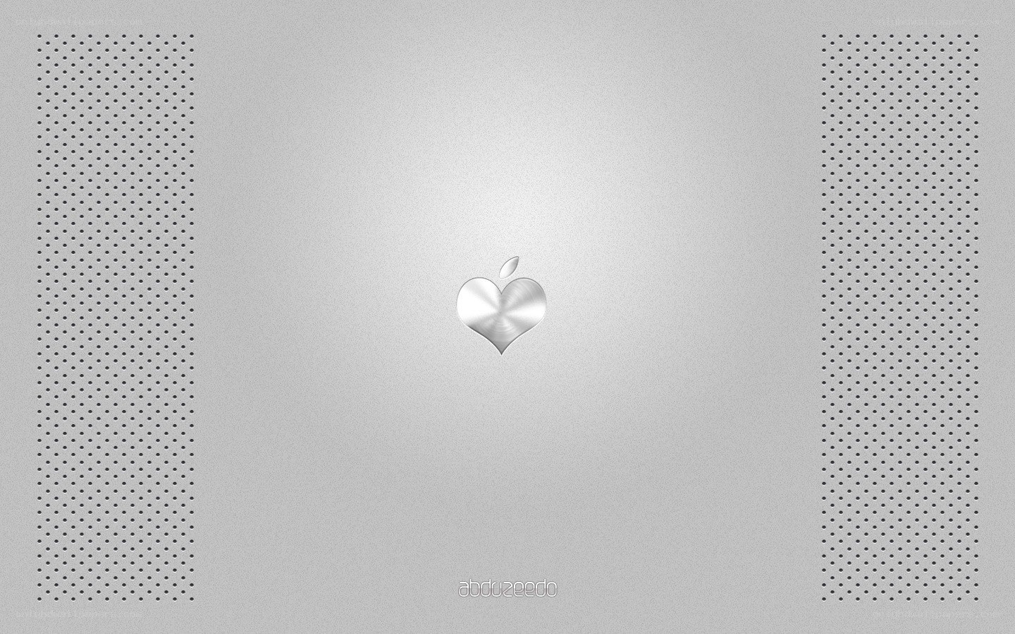 Apple heart logo on silver laptop