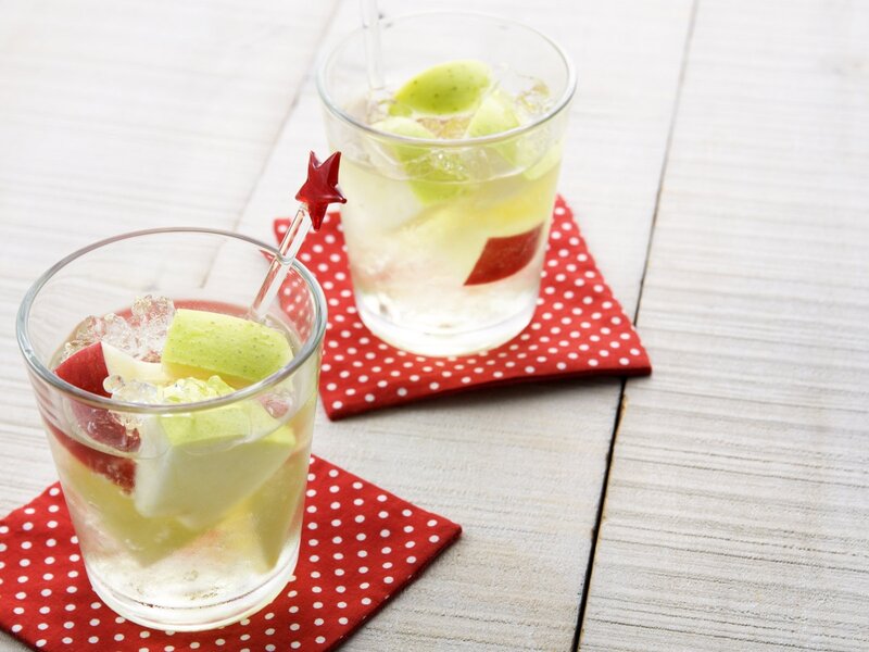 apple-infused drinks on coasters