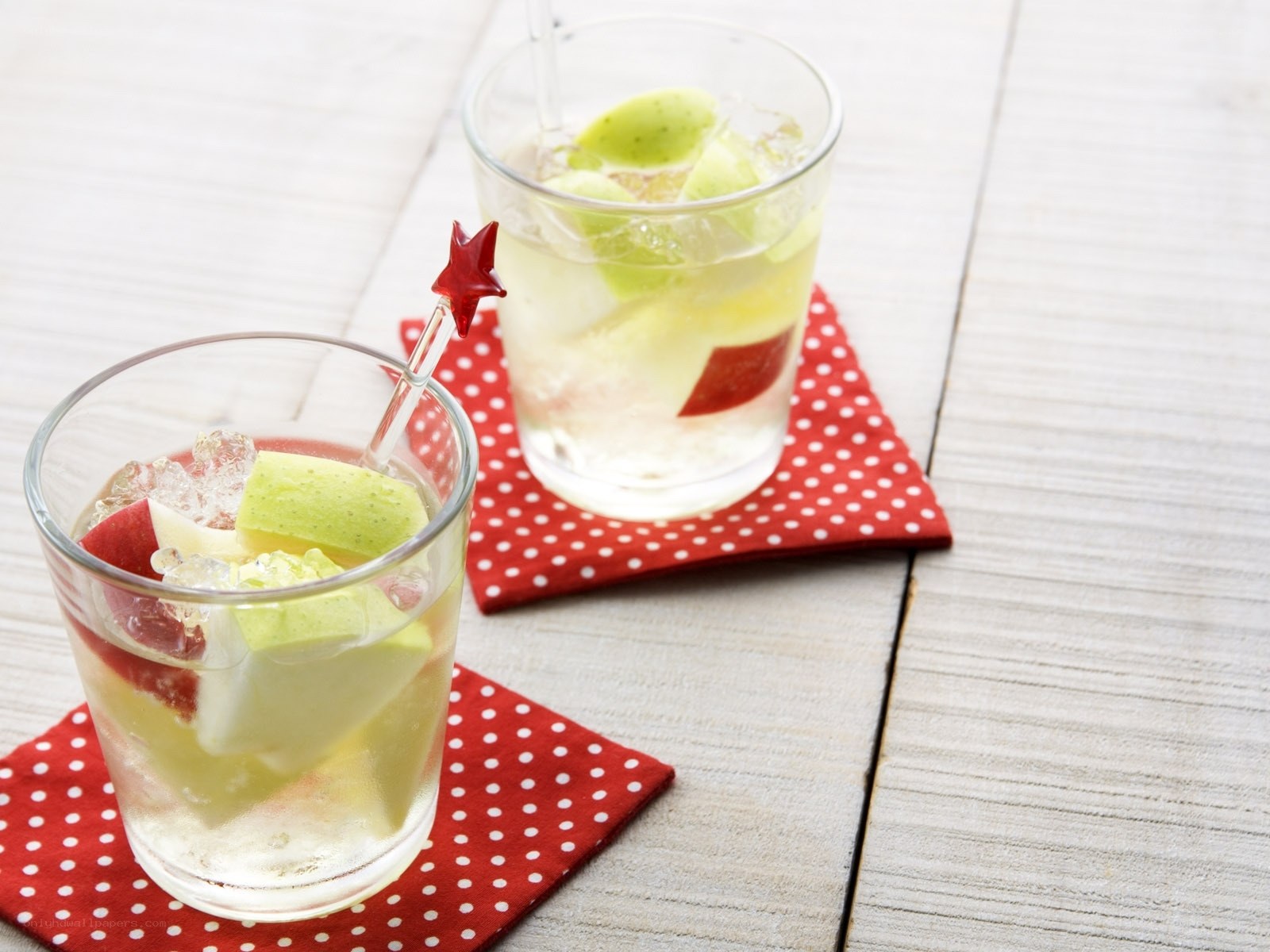 apple-infused drinks on coasters