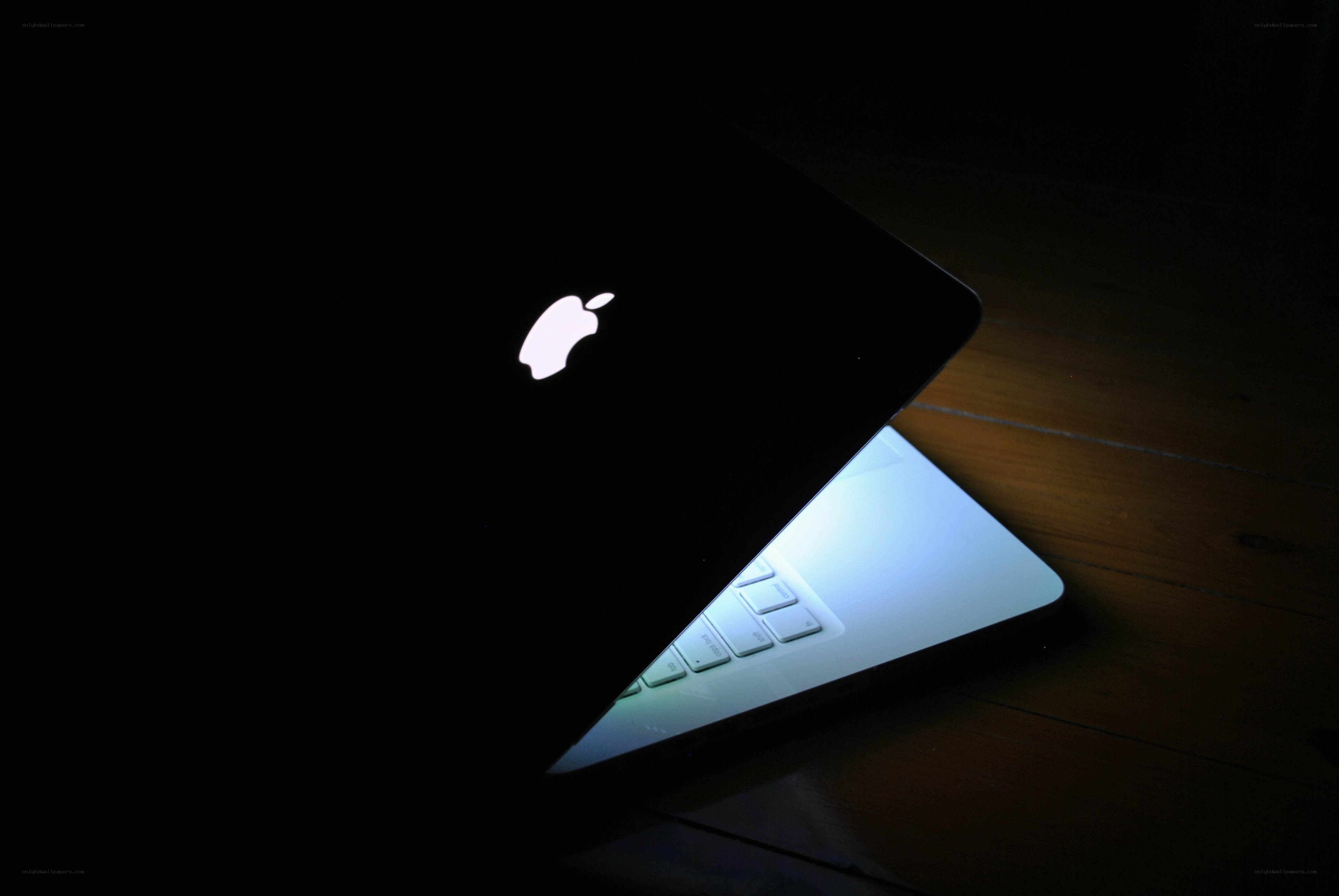 Apple laptop in dark room