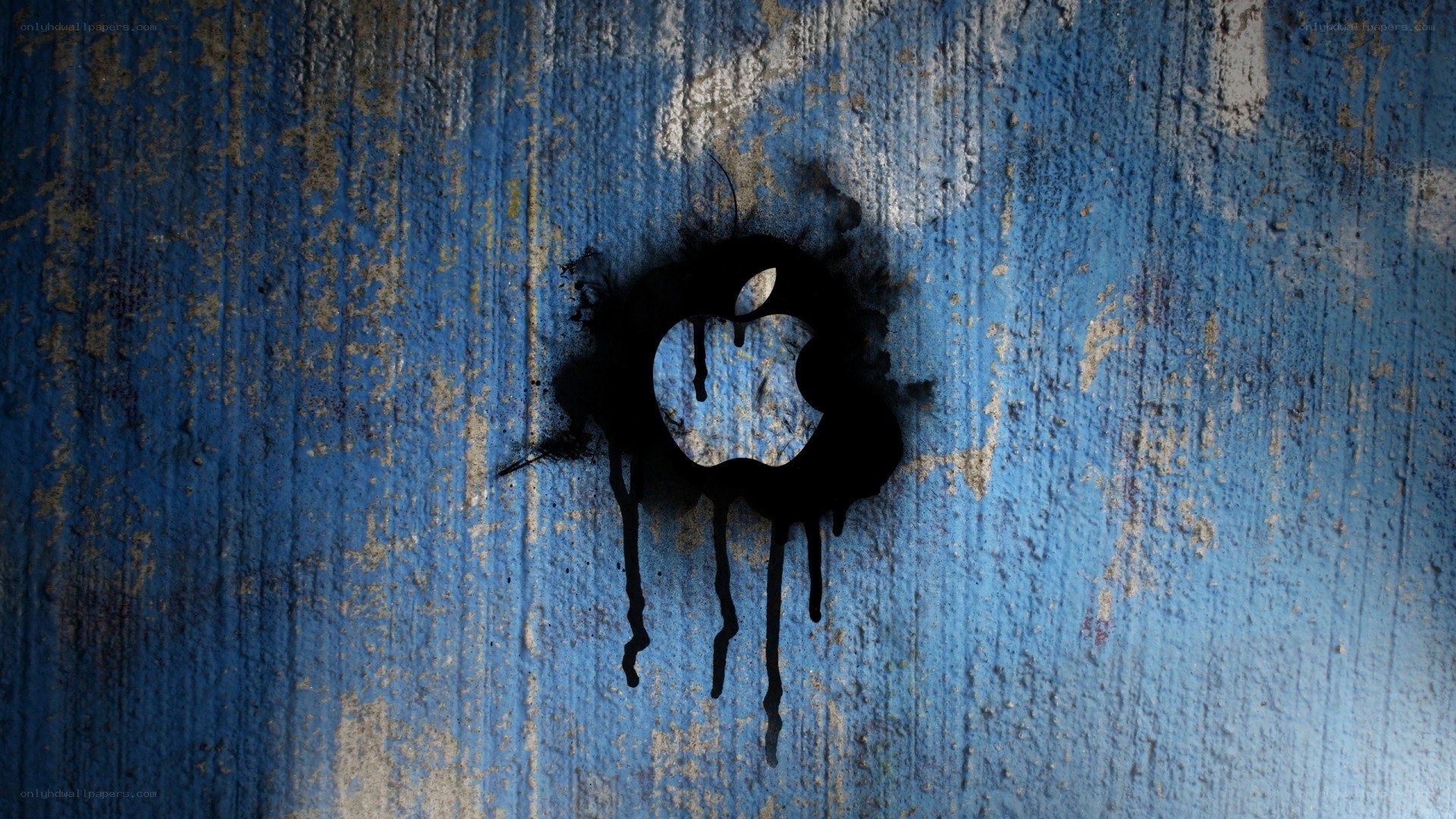 Apple logo on blue wall