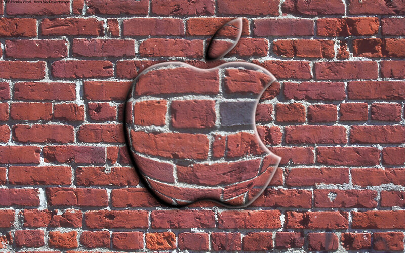 Apple logo on brick wall