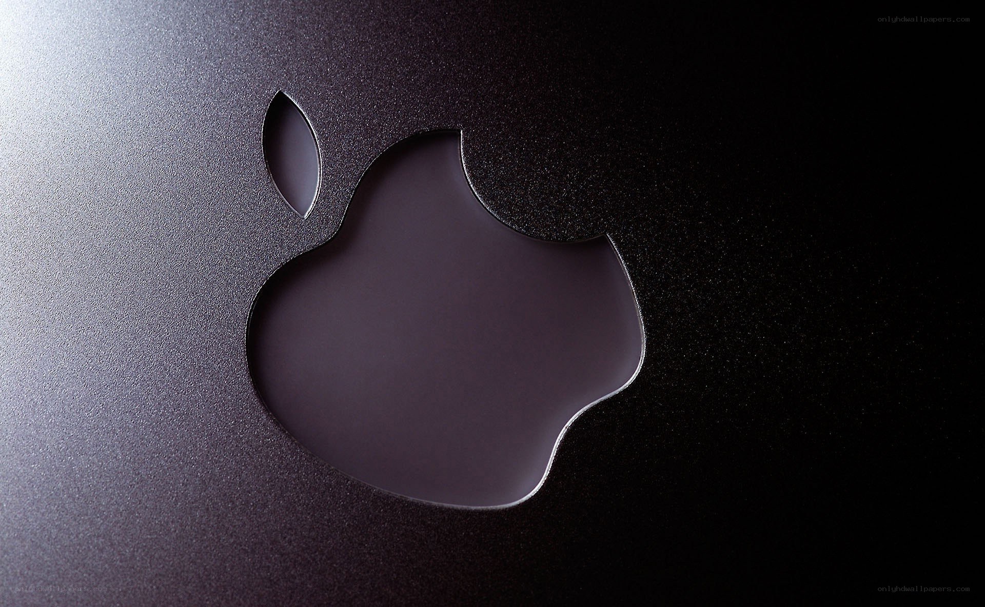Apple logo on dark surface