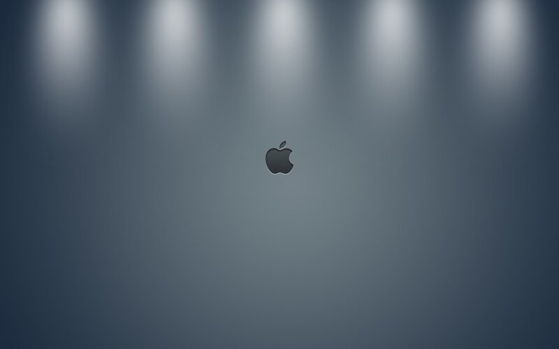Apple Logo on Dark Surface — Gray, Dramatic