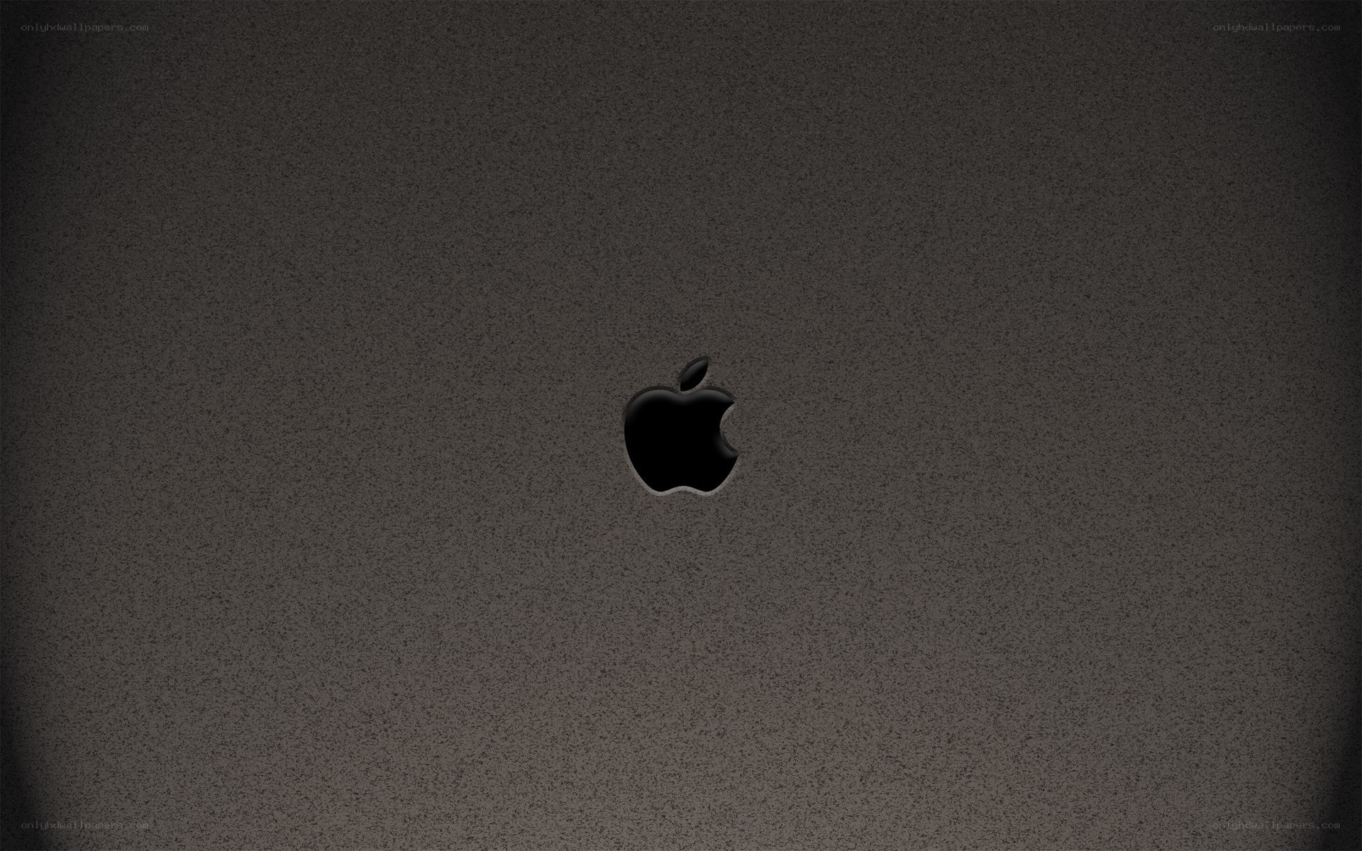 Apple logo on dark surface