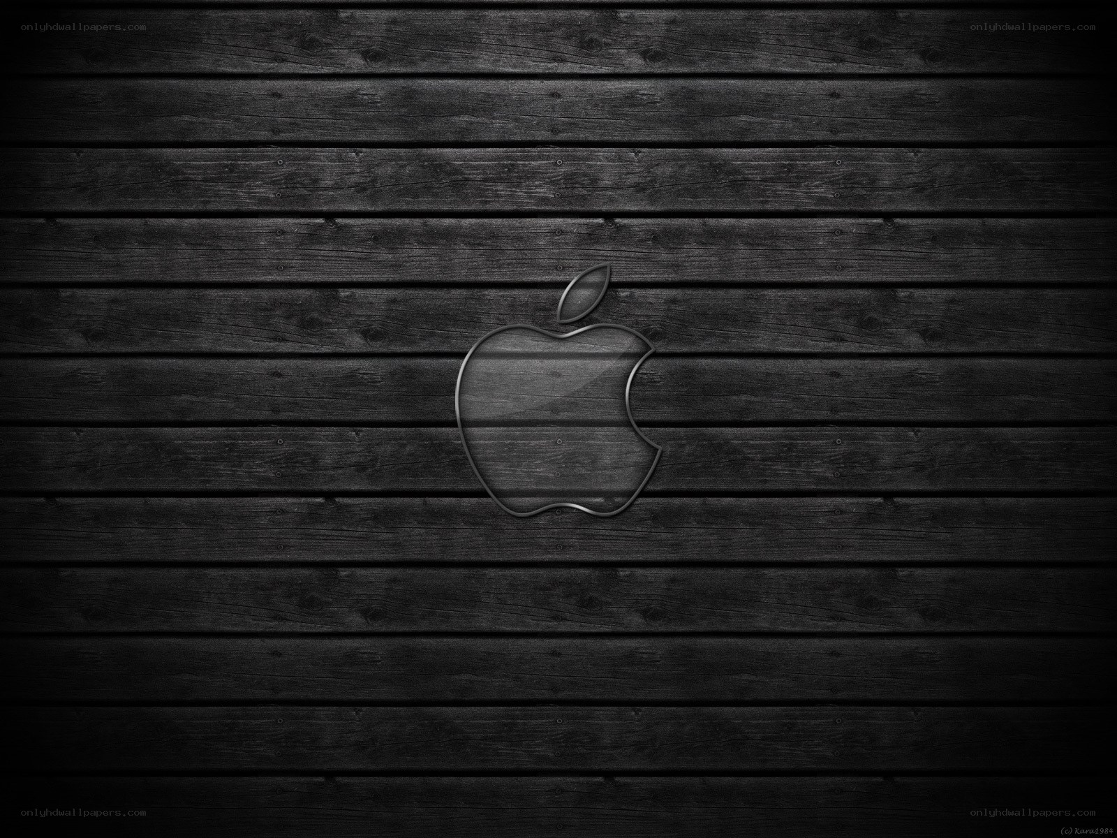 Apple logo on dark wood