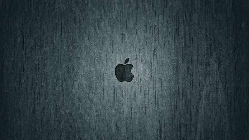 Apple logo on dark wood