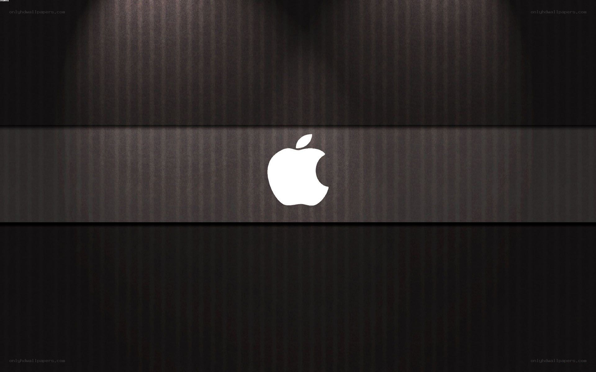 Apple logo on dark wood
