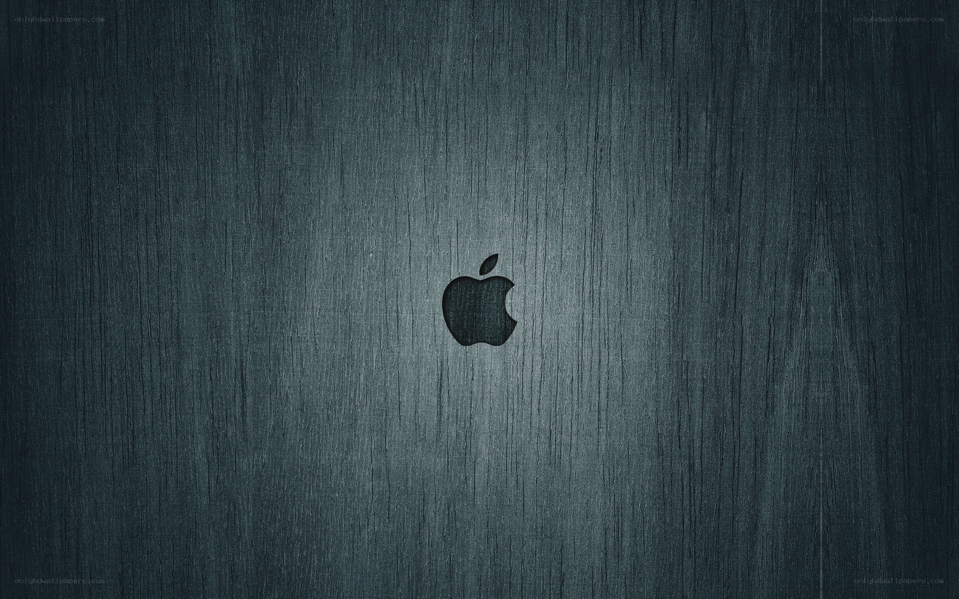 Apple logo on dark wood