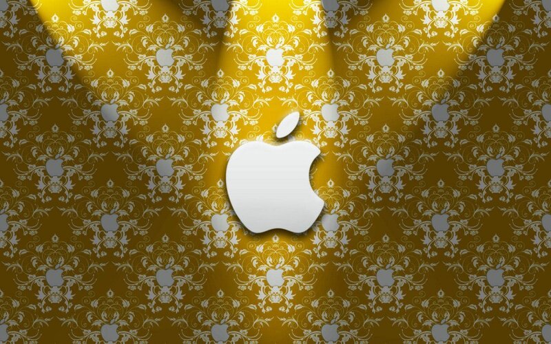 Apple logo on golden wallpaper