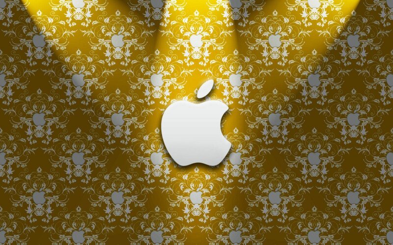 Apple logo on golden wallpaper