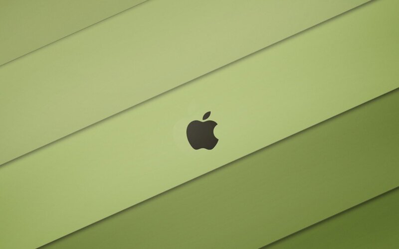 Apple Logo on Green Surface — Calm, Minimalist
