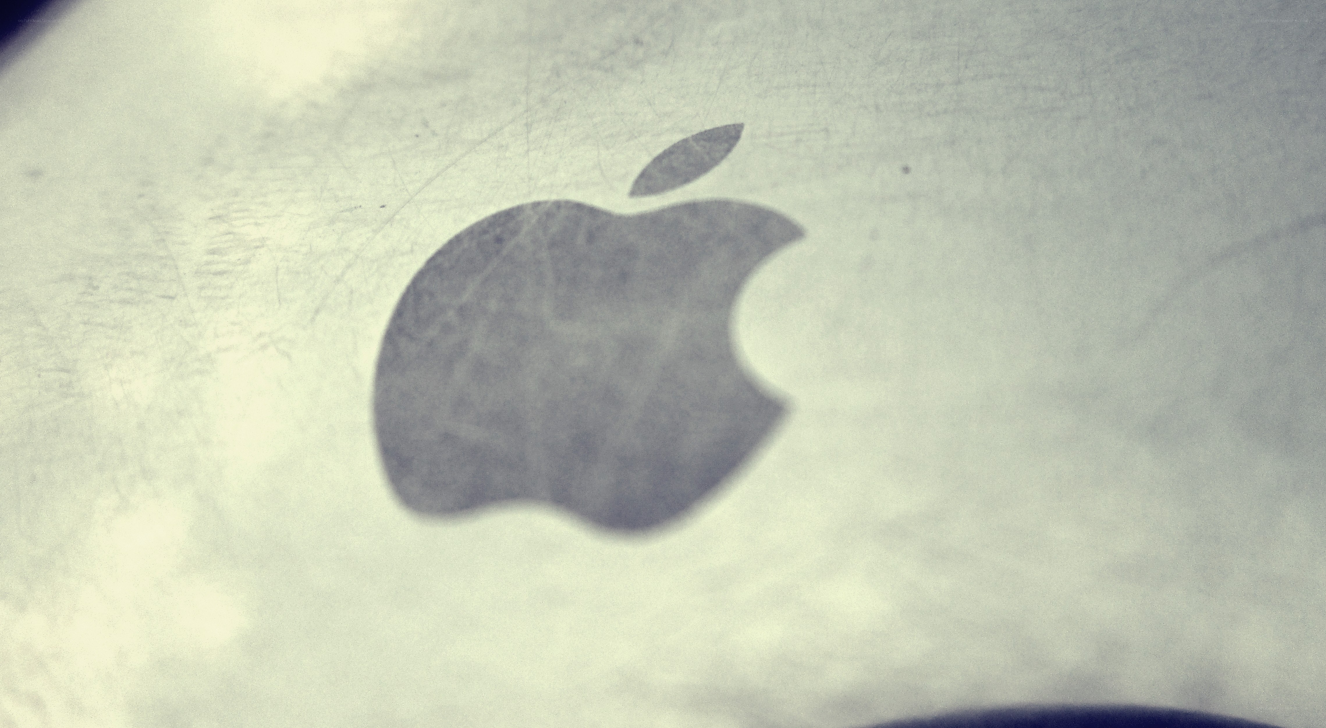 Apple logo on metal surface