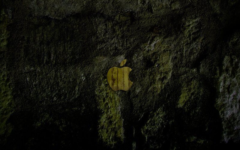 Apple logo on mossy wall