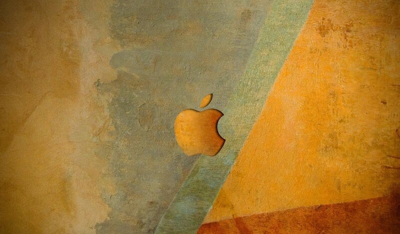 Apple Logo on Textured Surface — Orange