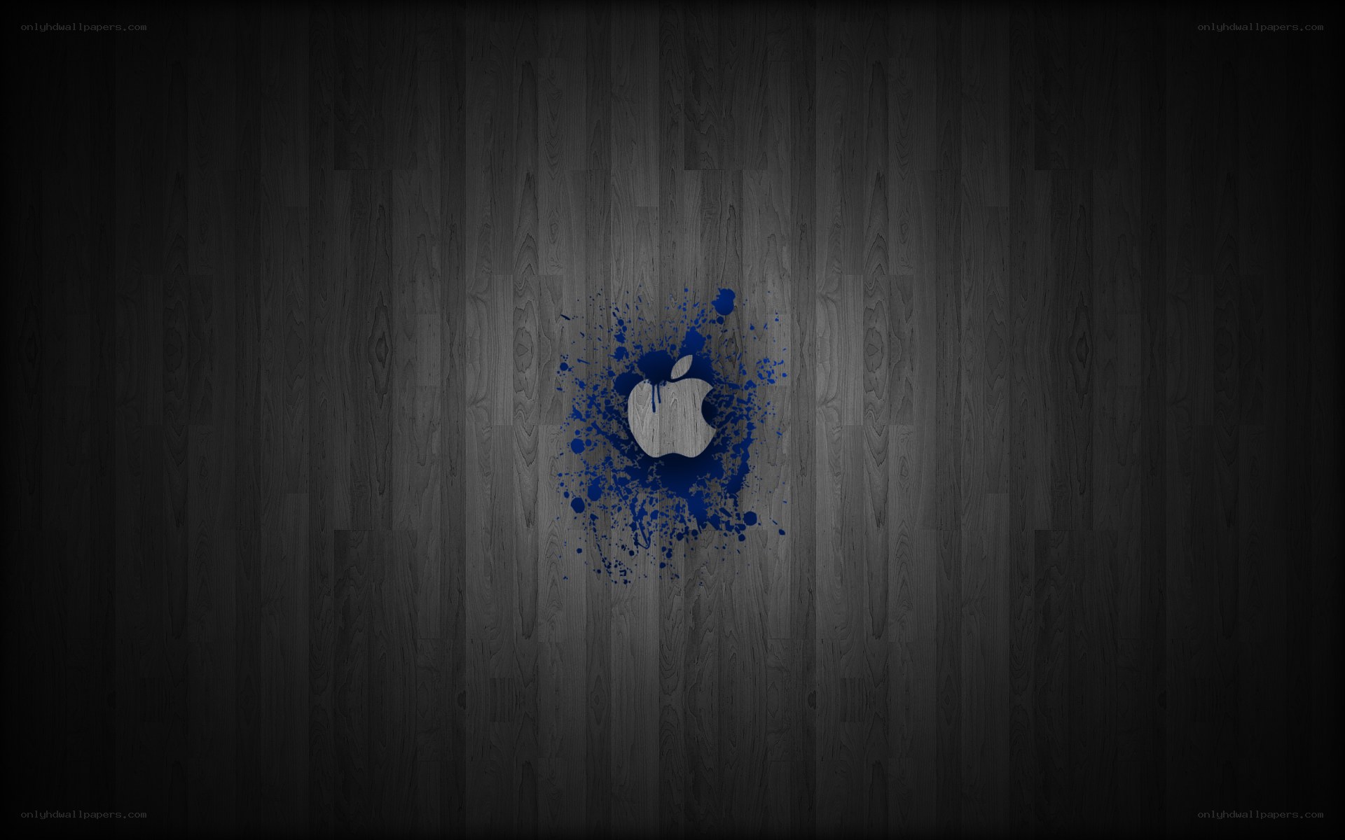 Apple logo splatter on wood