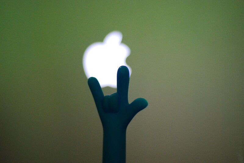 Apple logo with hand gesture