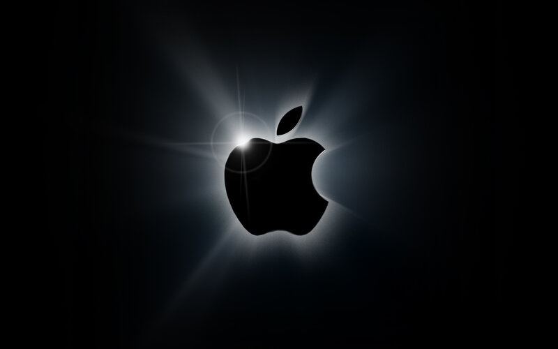 Apple logo with light burst