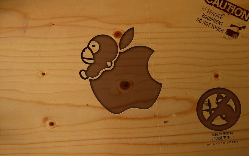 Apple logo with monkey carving