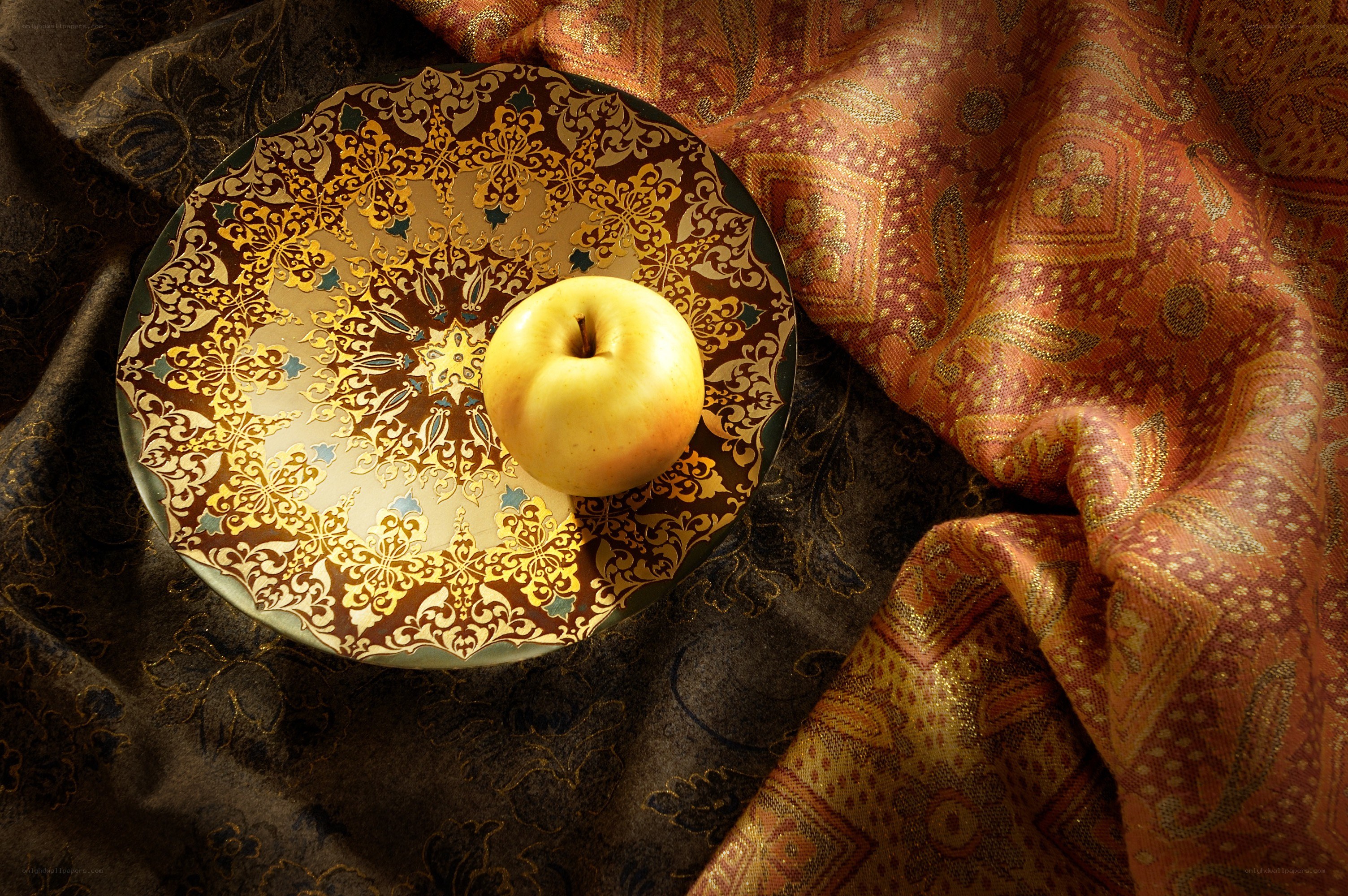 apple on ornate plate