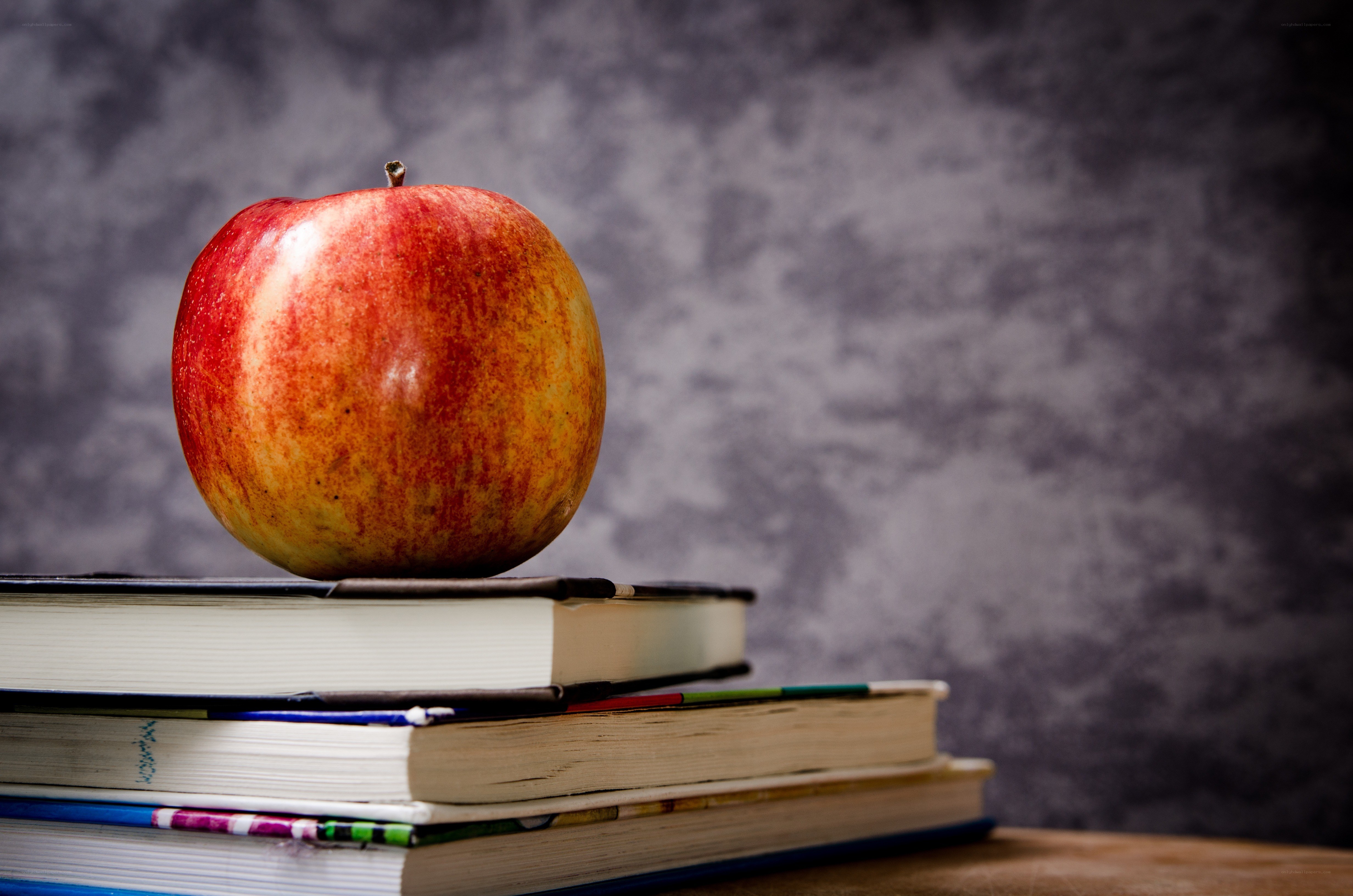 apple on stack of books