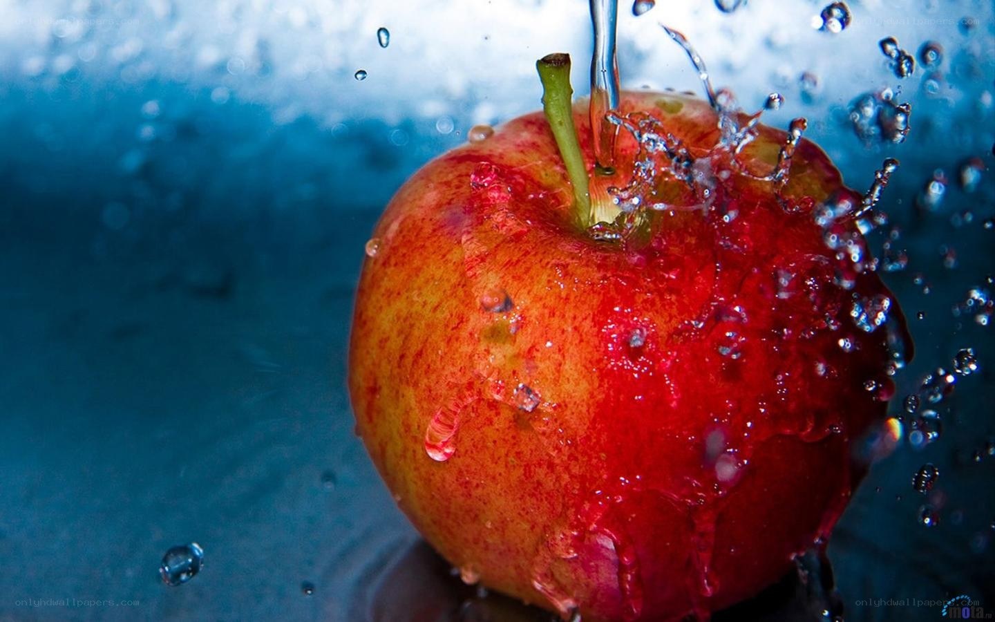 apple splashing in water