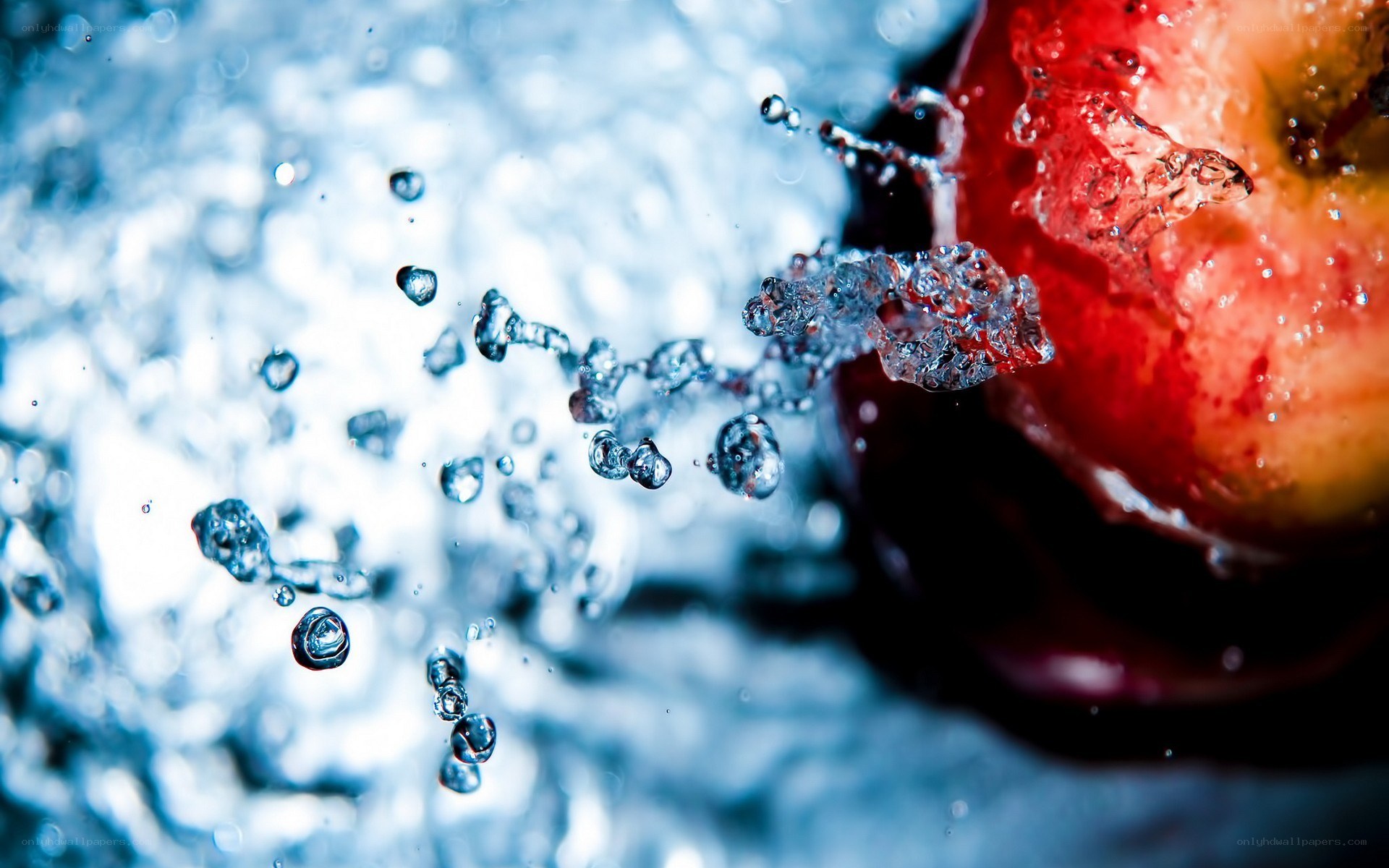 apple splashing in water