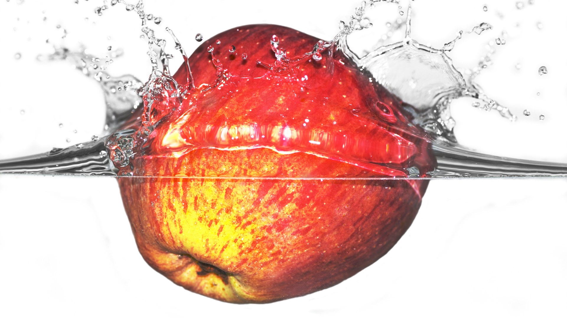 apple splashing in water