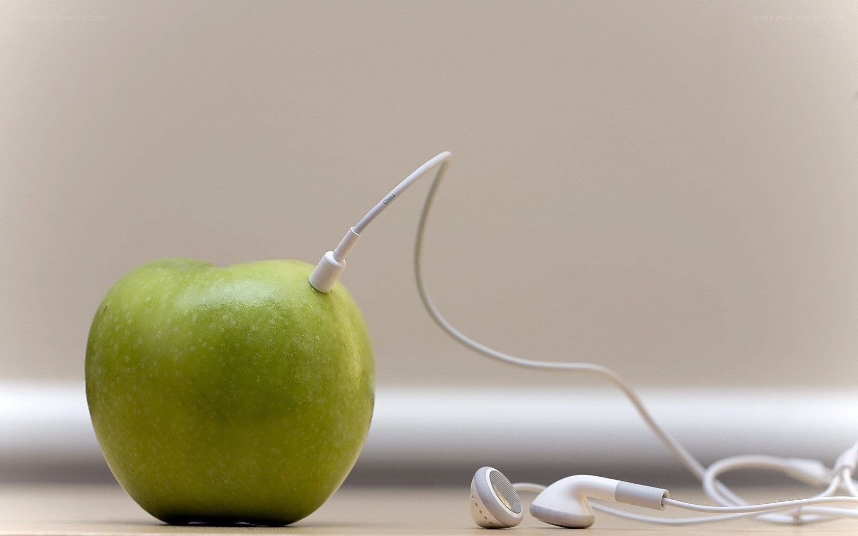 apple with earbuds
