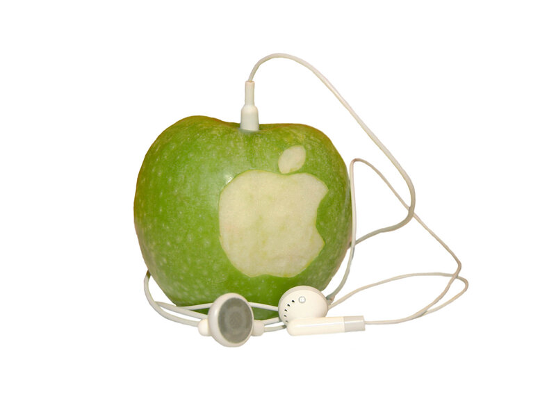Apple with earbuds