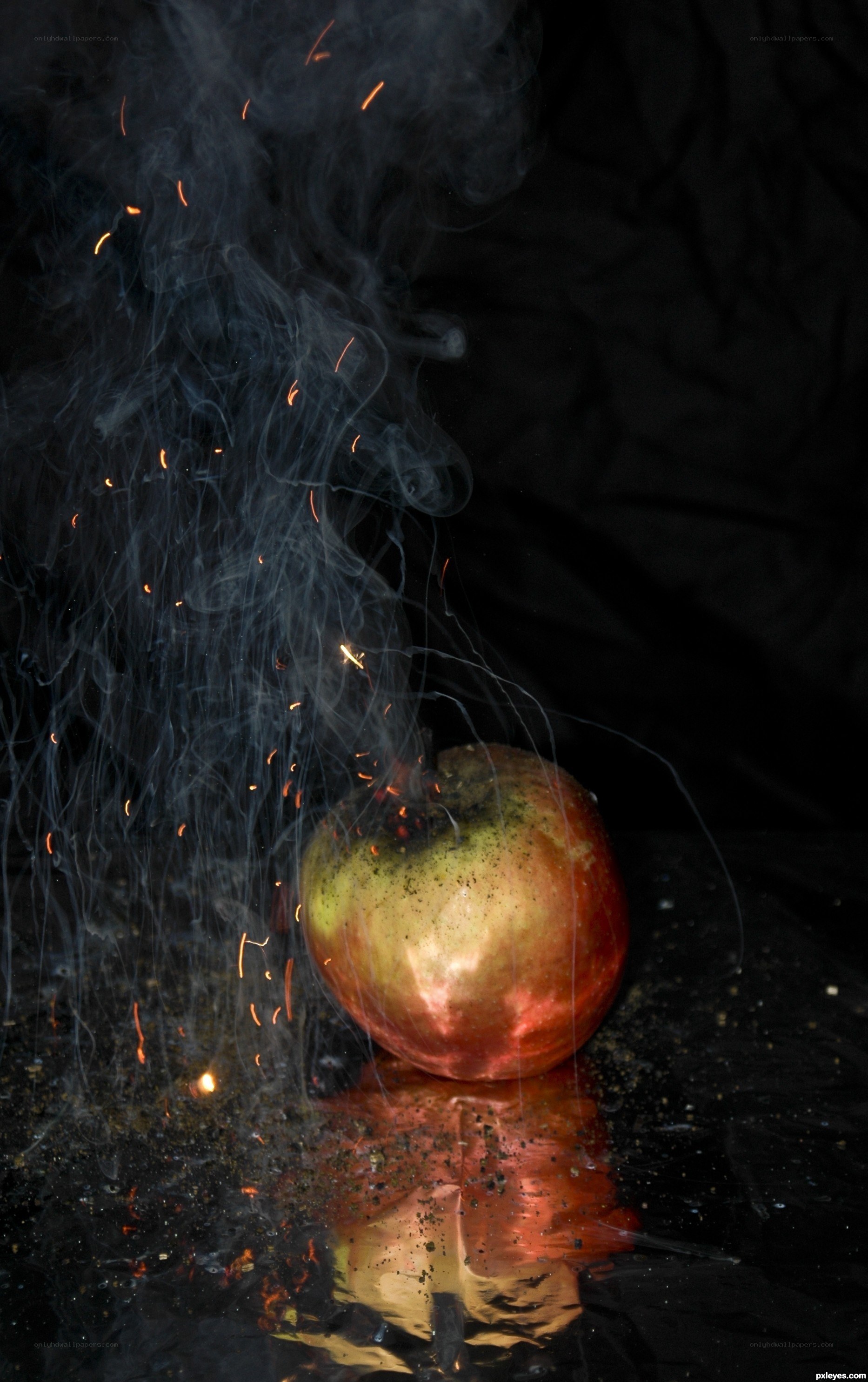 apple with sparks and smoke