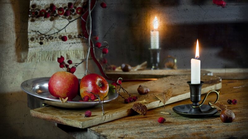 Apples and Candle on Wood