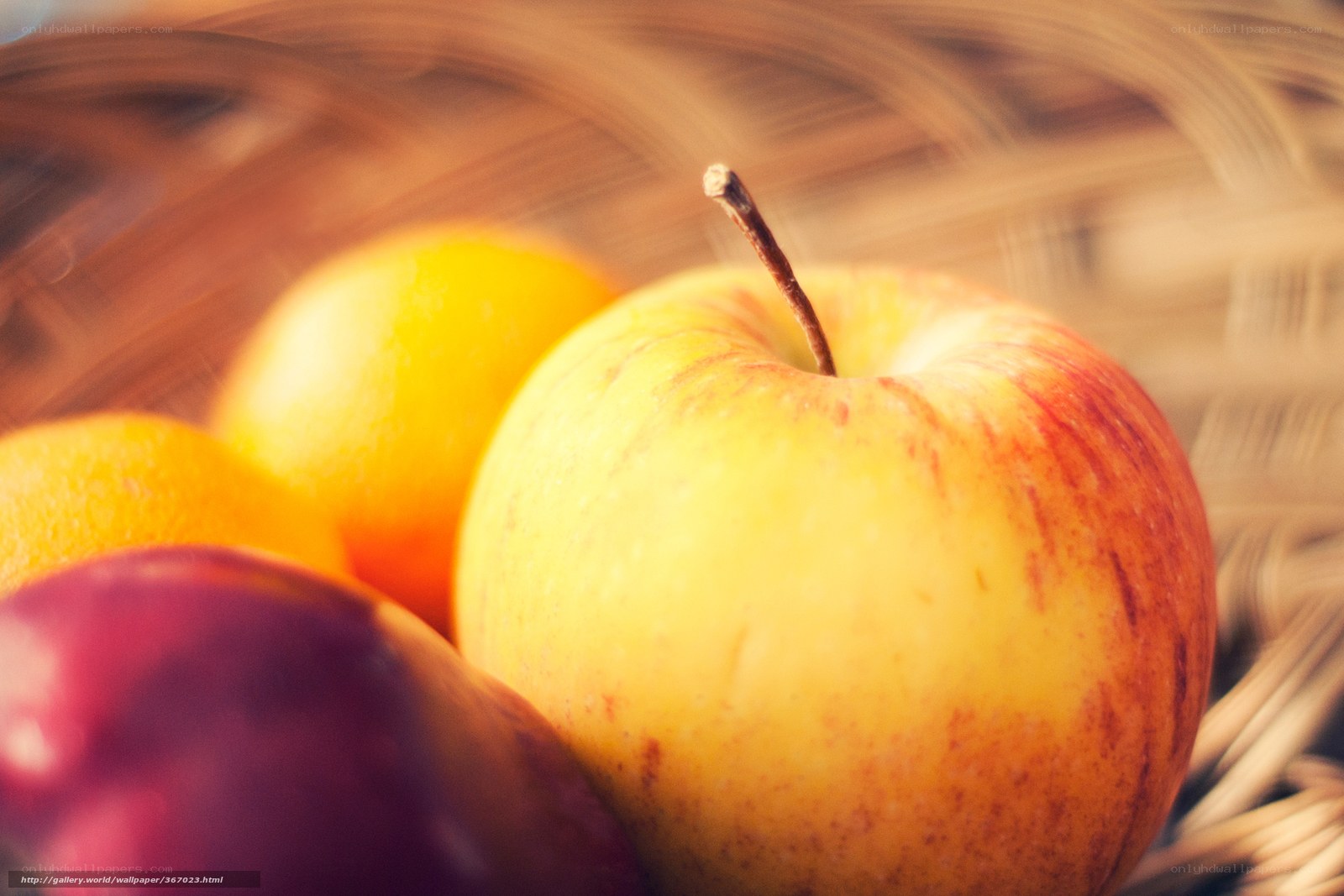 apples and oranges in basket