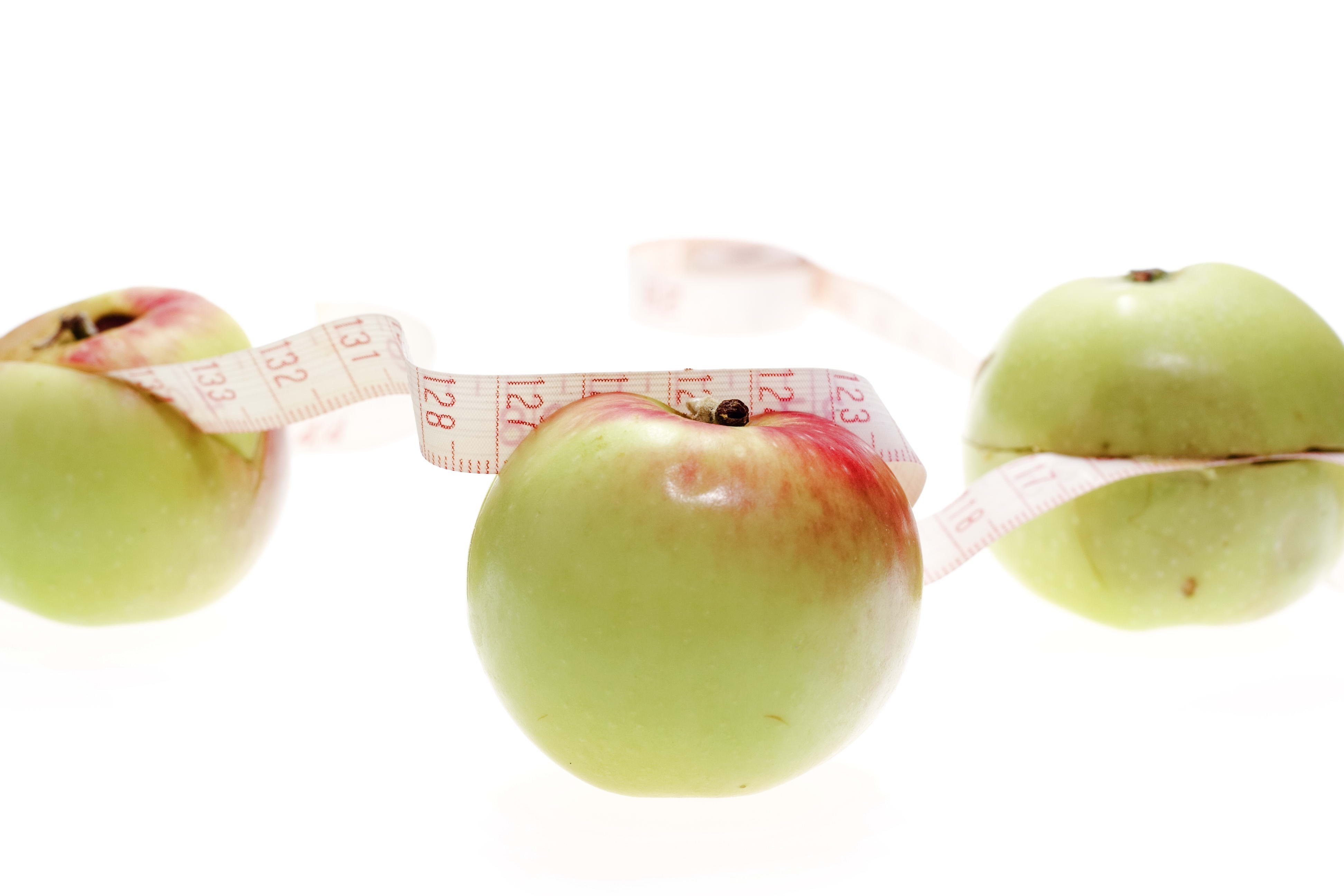 apples with measuring tape