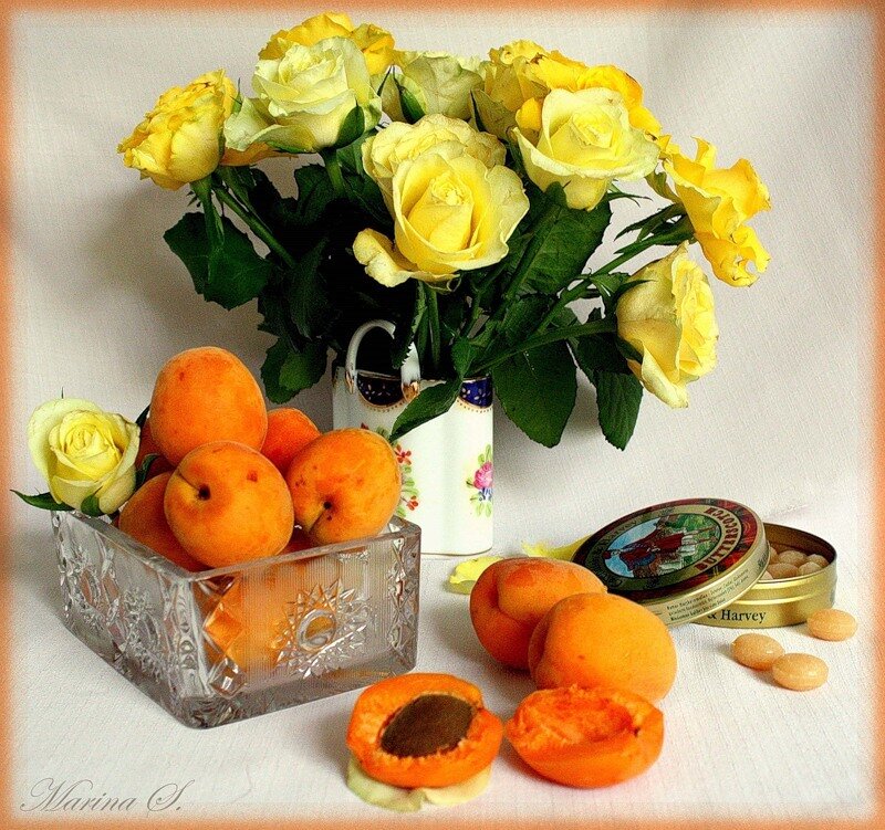 Apricots and yellow roses